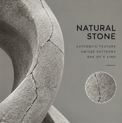 Close-up of the infinity sculpture's rough gray surface and branching dark vein-like patterns