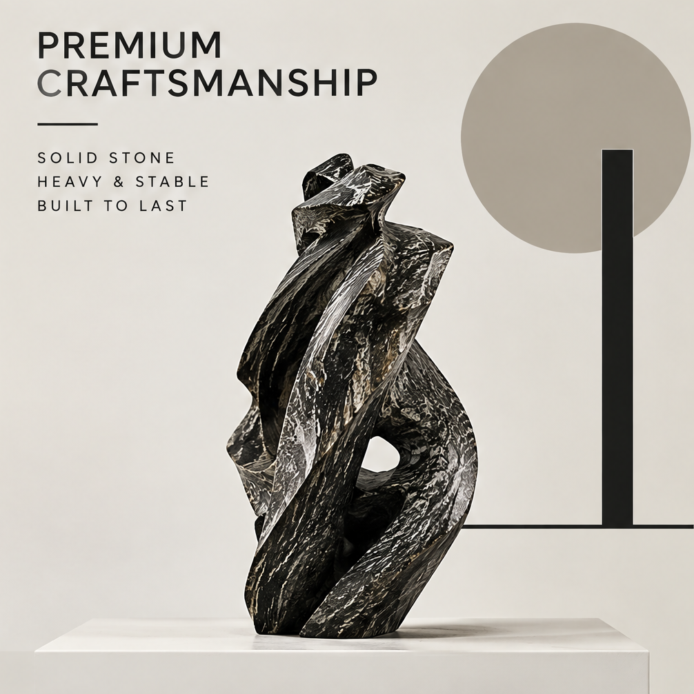 Side view of the black stone sculpture showing layered contours, pale veins, and sculptural openings