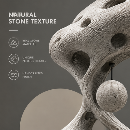 CELORM cream-gray organic curve sculpture with rounded openings and a sphere suspended from a black stem