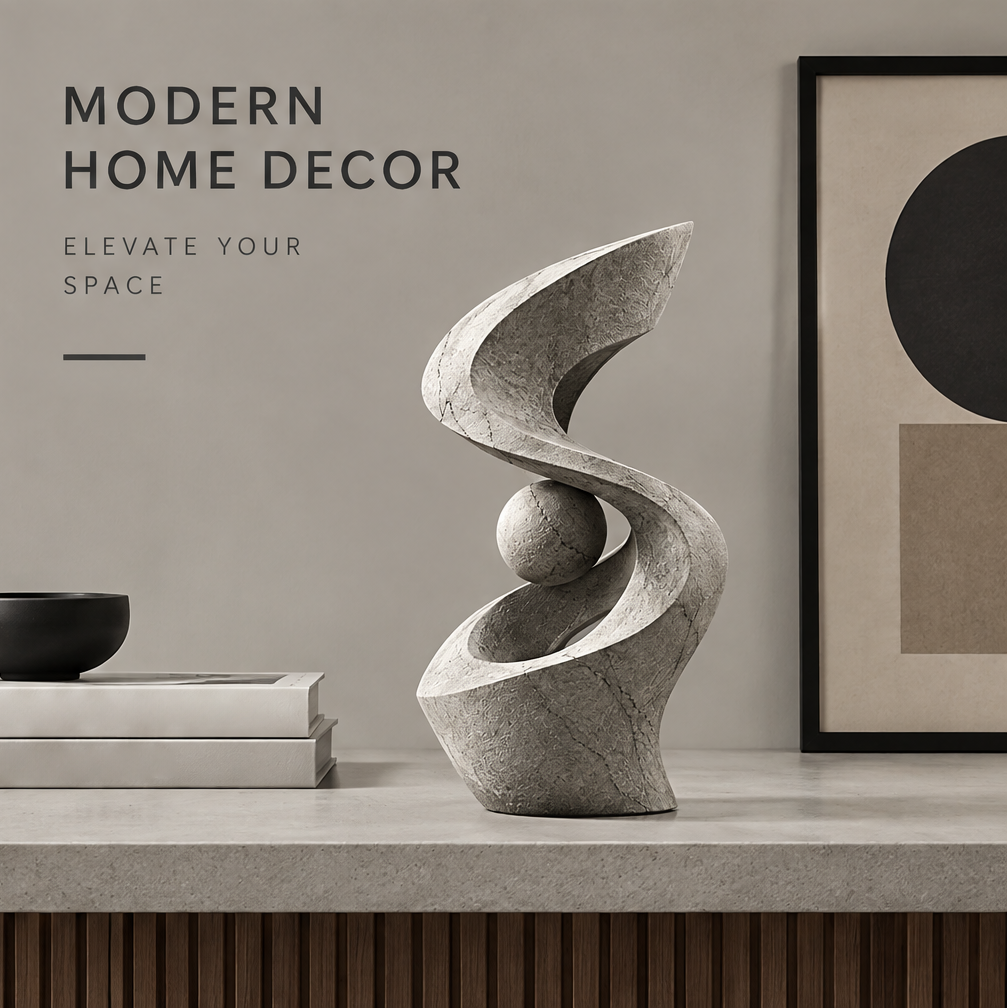 Spiral sphere sculpture styled on a console beside neutral books, a dark bowl, and geometric artwork