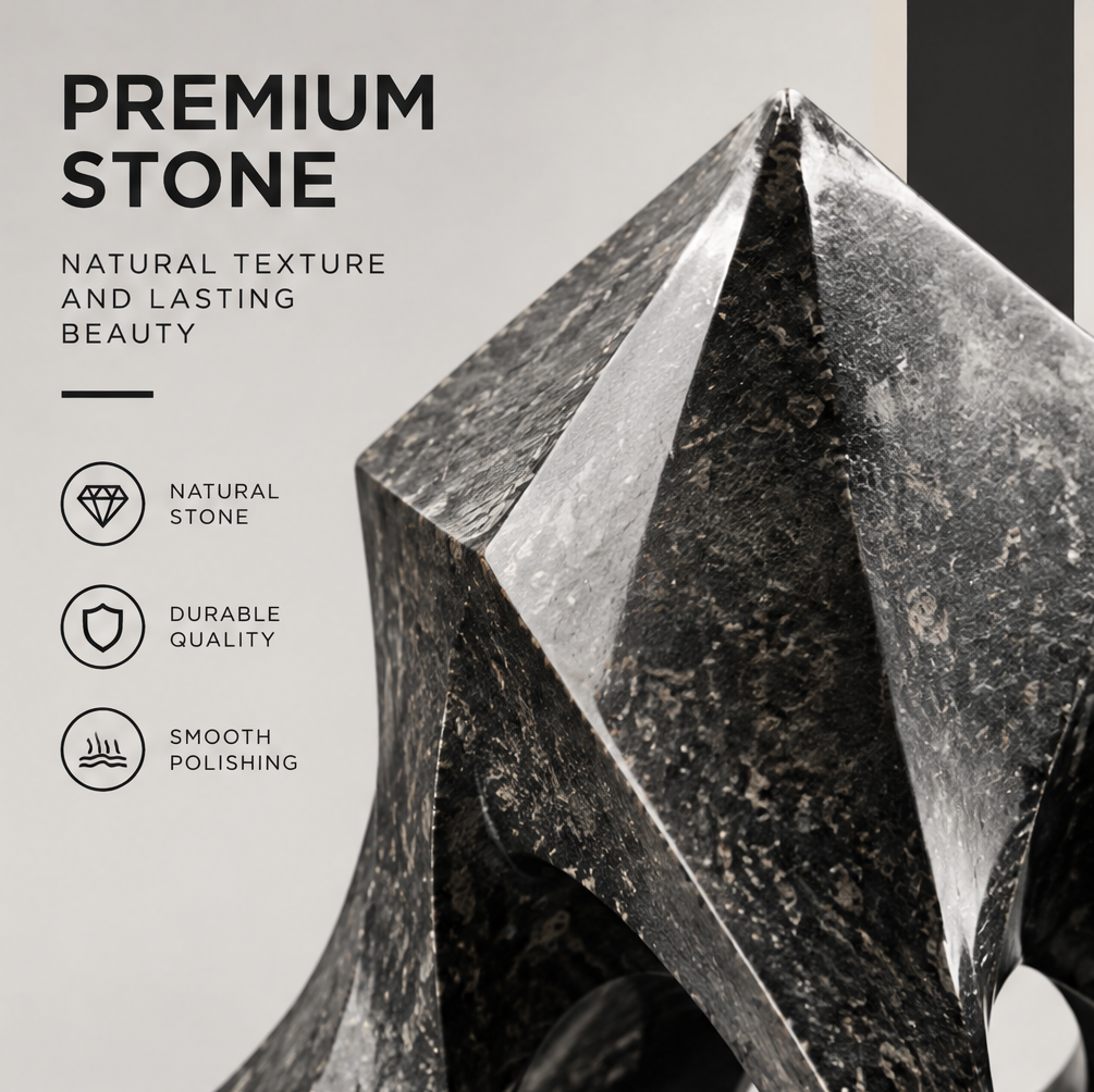 Detail of a pointed upper edge and polished curved plane on the black geometric sculpture